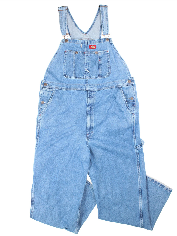 Dickies Dungarees in blue colourway with multiple pockets, adjustable straps and the logo embroidered on the front.