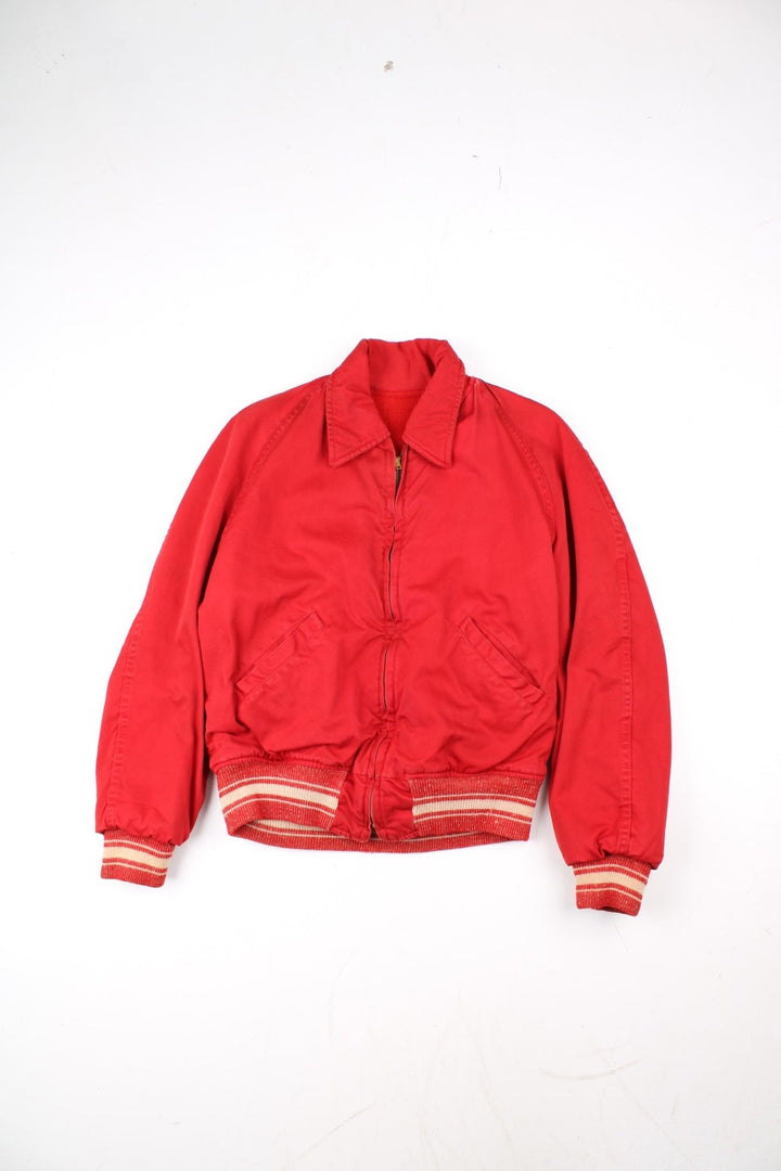 Vintage 70's Reversible Varsity Jacket in a red colourway with either canvas or woolen reversible options. Zips up and has side pockets, and has 'American Turner Social' logo embroidered on the front and back.
