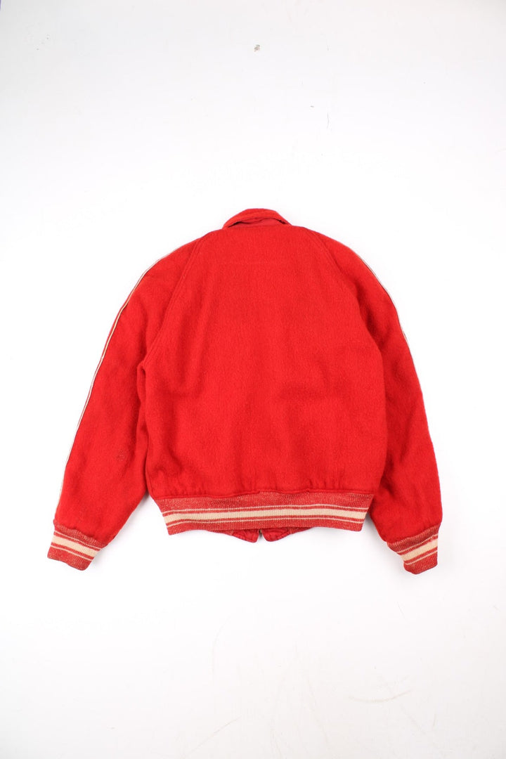 Vintage 70's Reversible Varsity Jacket in a red colourway with either canvas or woolen reversible options. Zips up and has side pockets, and has 'American Turner Social' logo embroidered on the front and back.