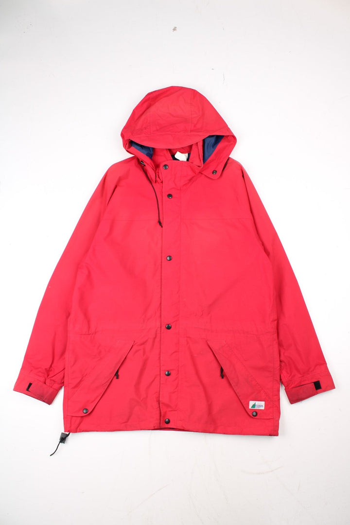 Vintage Mountain Equipment Jacket in a red colourway. Zips up and has side pockets, hooded, and has the logo embroidered on the front by the hem.