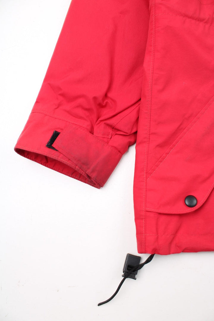 Vintage Mountain Equipment Jacket in a red colourway. Zips up and has side pockets, hooded, and has the logo embroidered on the front by the hem.