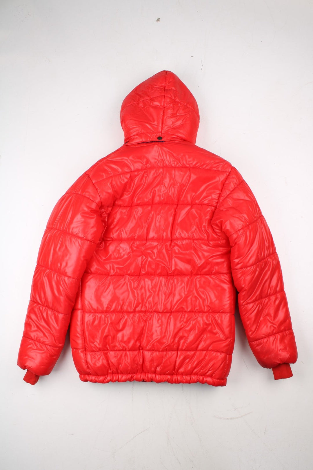 Vintage 80's Mountain Equipment Cerro Torre Puffer Coat in a red colourway. Zips and buttons up, has double front pockets, insulated lining, detachable hood, and has the logo embroidered on the front.