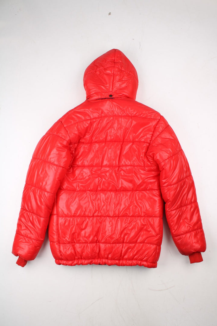 Vintage 80's Mountain Equipment Cerro Torre Puffer Coat in a red colourway. Zips and buttons up, has double front pockets, insulated lining, detachable hood, and has the logo embroidered on the front.
