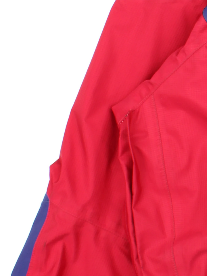 Vintage 90's Berghaus Manaslu Gore-Tex Coat in a red/blue colourway, zips up and has multiple pockets, hooded, insulated with a Gore-tex lining, and has the logo embroidered on the front.