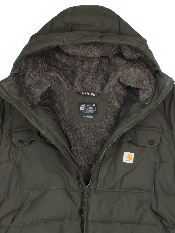 Carhartt Montana Puffer Coat in a black colourway, zips up and has multiple pockets, hooded and has the logo embroidered on the front.