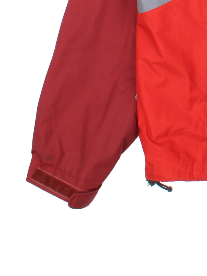 Nike ACG Coat in a red colourway with contrasting red and grey panelling. full zip up, hood and has multiple pockets, classic logo embroidered on the front.