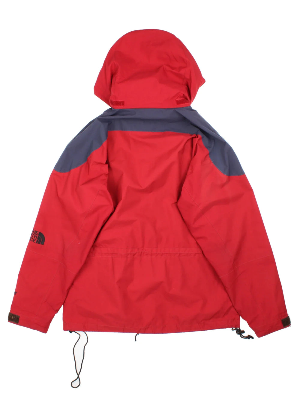 The North Face Coat in a red colourway with black panelling, full zip up and has multiple pockets, hooded and has the logo embroidered on the sleeve.
