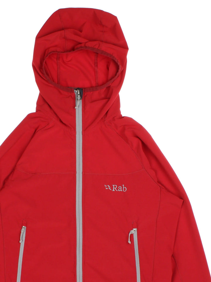 Vintage Rab Ventus Jacket in a red colourway with hood and contrast grey zip fastening/pockets. Logo embroidered on the front.