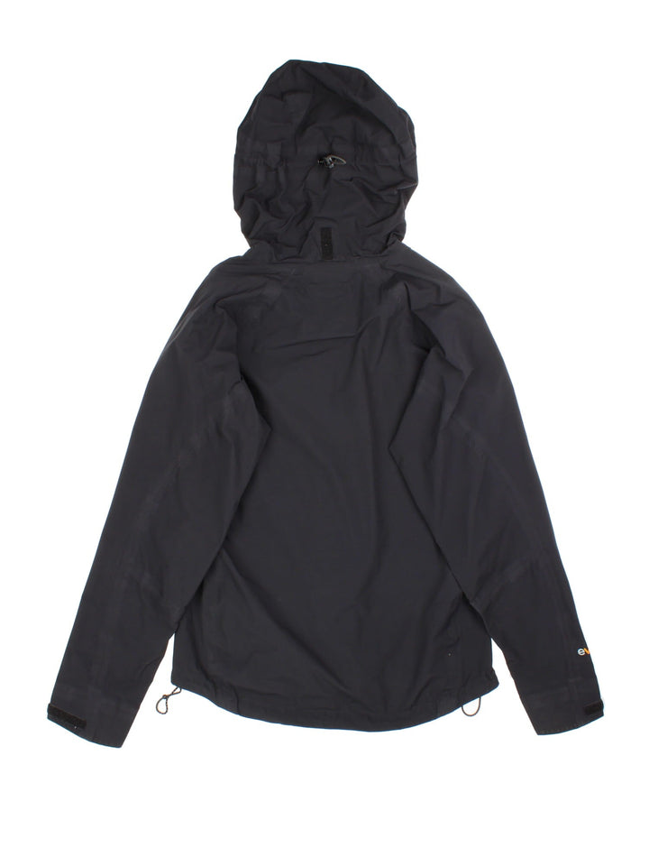 Vintage Rab Neutrino Jacket in a black colourway. Zip fastening with hood and zipped pockets. Contrast grey lining and embroided logo.