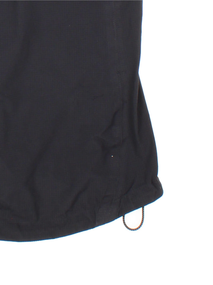 Vintage Rab Neutrino Jacket in a black colourway. Zip fastening with hood and zipped pockets. Contrast grey lining and embroided logo.