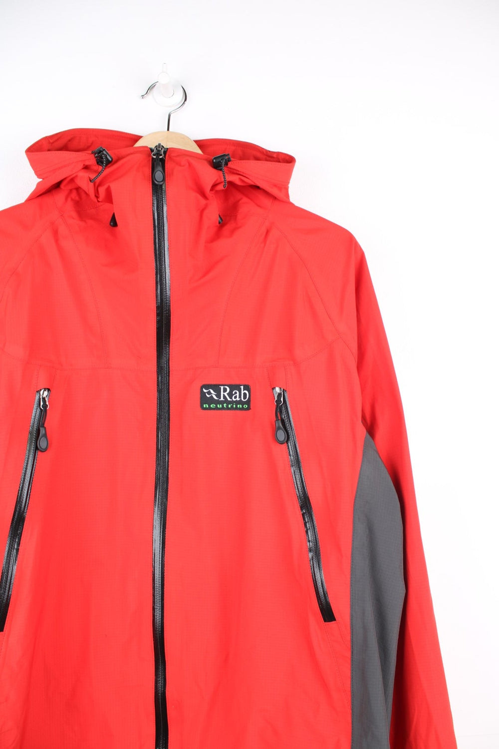 Vintage red and grey Rab neutrino hooded rain jacket. Features embroidered logo on the chest. 