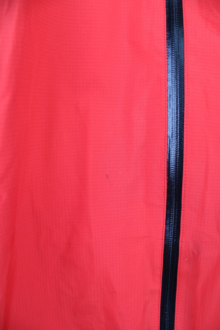 Vintage red and grey Rab neutrino hooded rain jacket. Features embroidered logo on the chest. 
