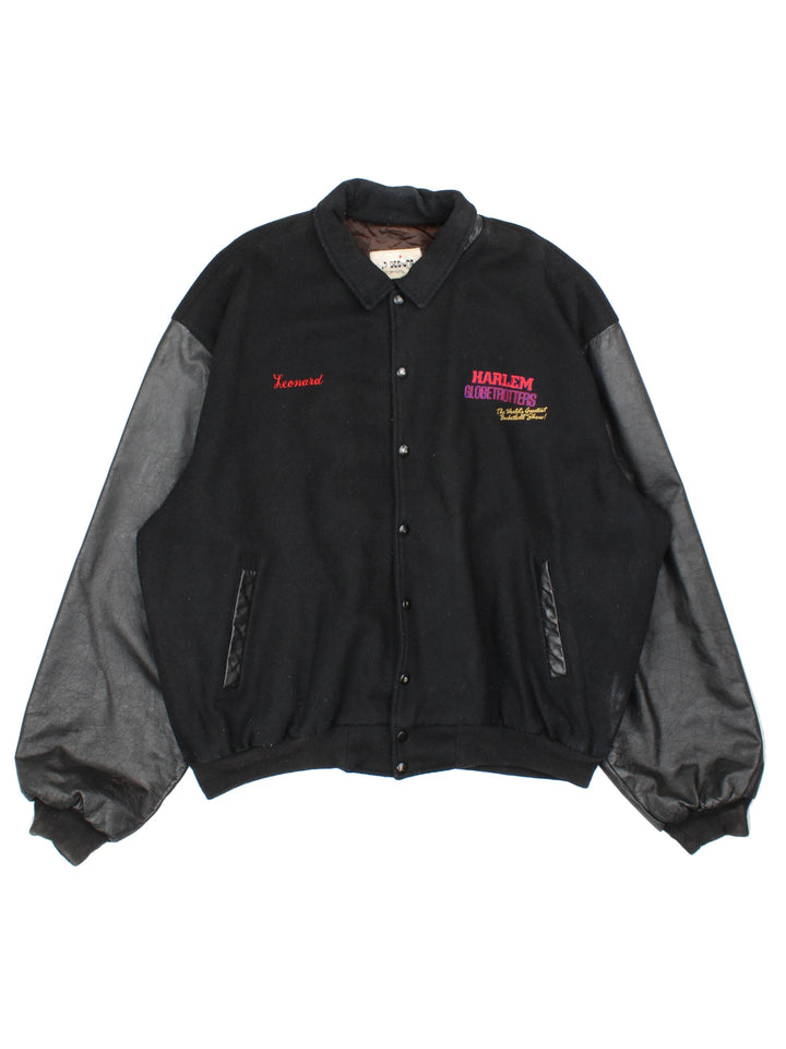 Vintage Harlem Globetrotters 'World Tour' varsity jacket by LP Designs, features embroidered name, badges and spell-out motif on the back