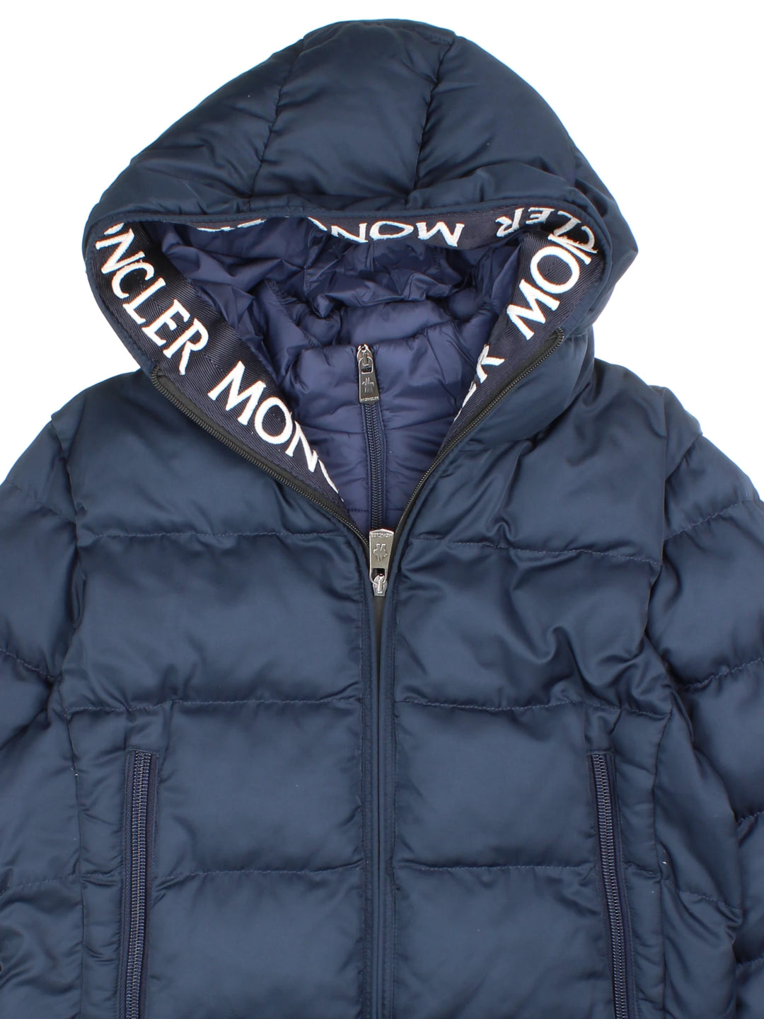 Moncler Cardere down puffer coat in a navy blue colourway. The coat has a puffer lining and the Moncler logo embroidered around the collar. There are extra thermal lined cuffs and a double zip for extra warmth.  