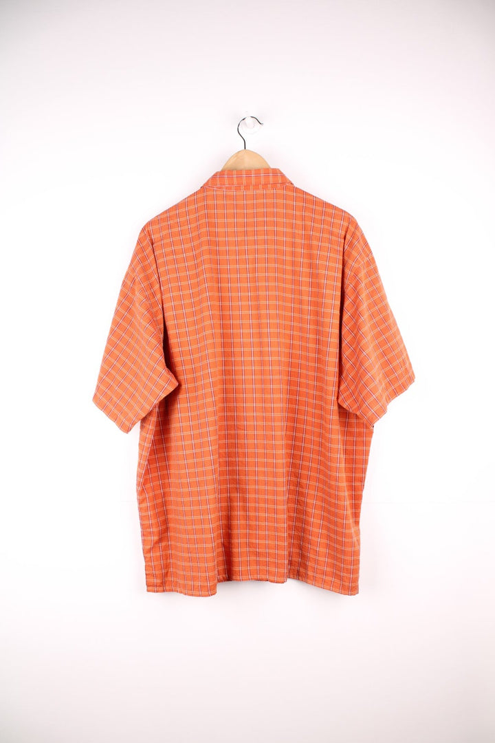 Patagonia plaid button through short sleeved shirt in orange with chest pocket and embroidered logo. 