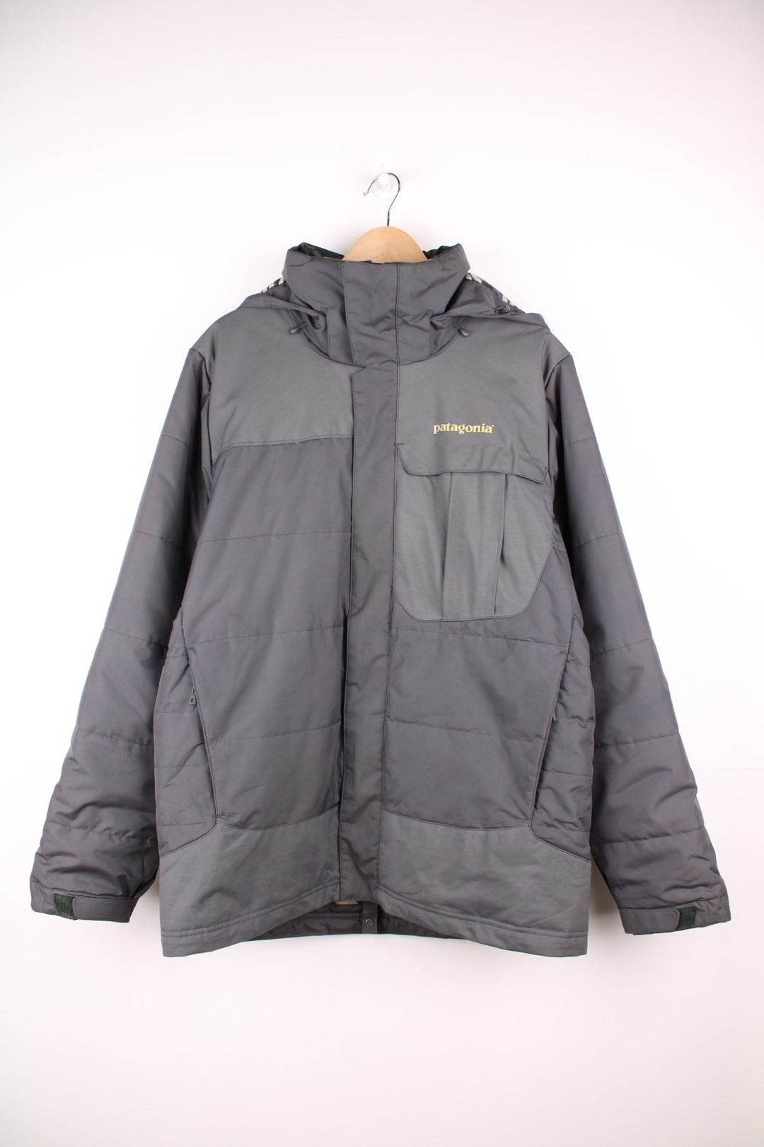 Patagonia puffer coat with printed logo on the chest and sleeve, multiple pockets and removable hood. 