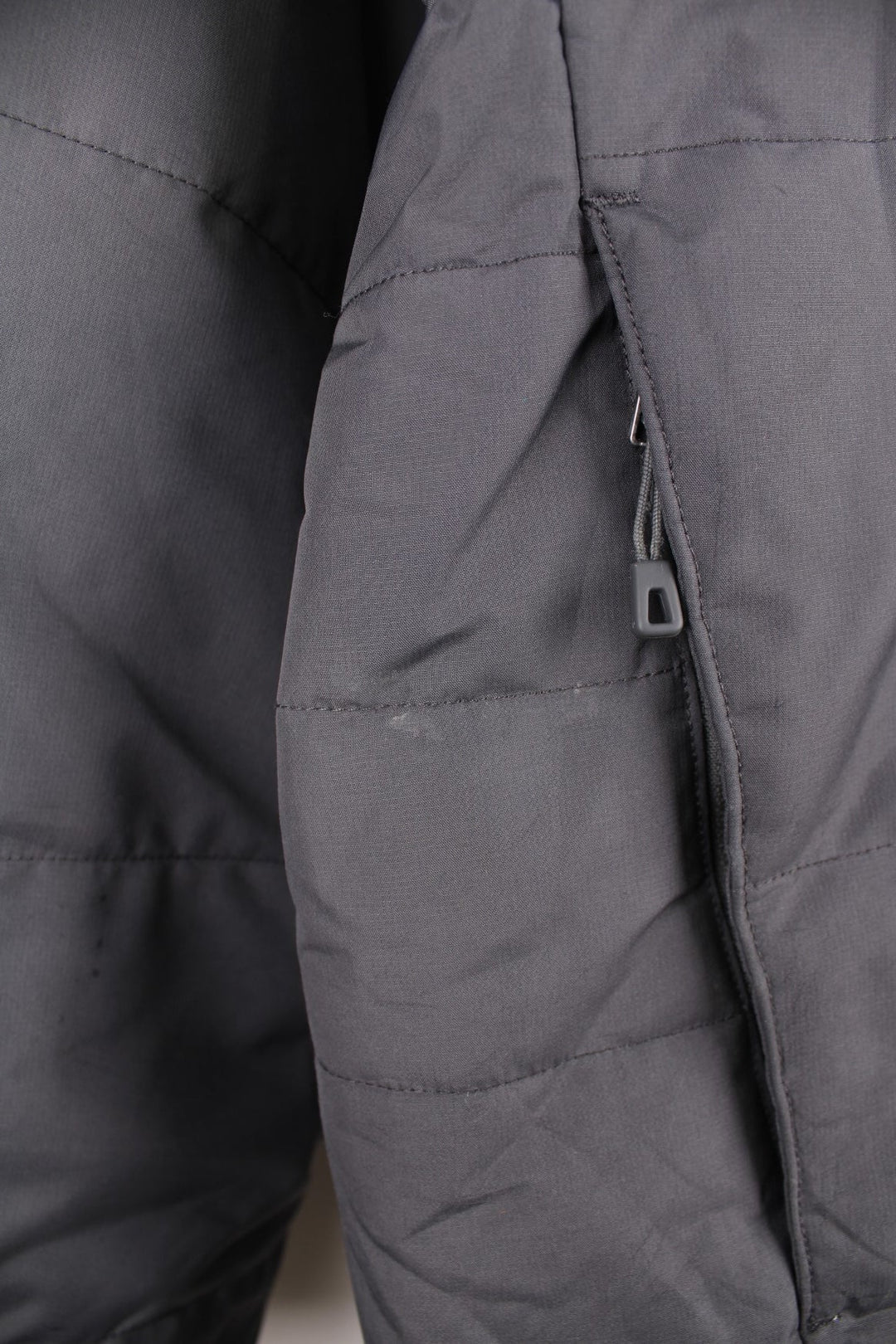 Patagonia puffer coat with printed logo on the chest and sleeve, multiple pockets and removable hood. 