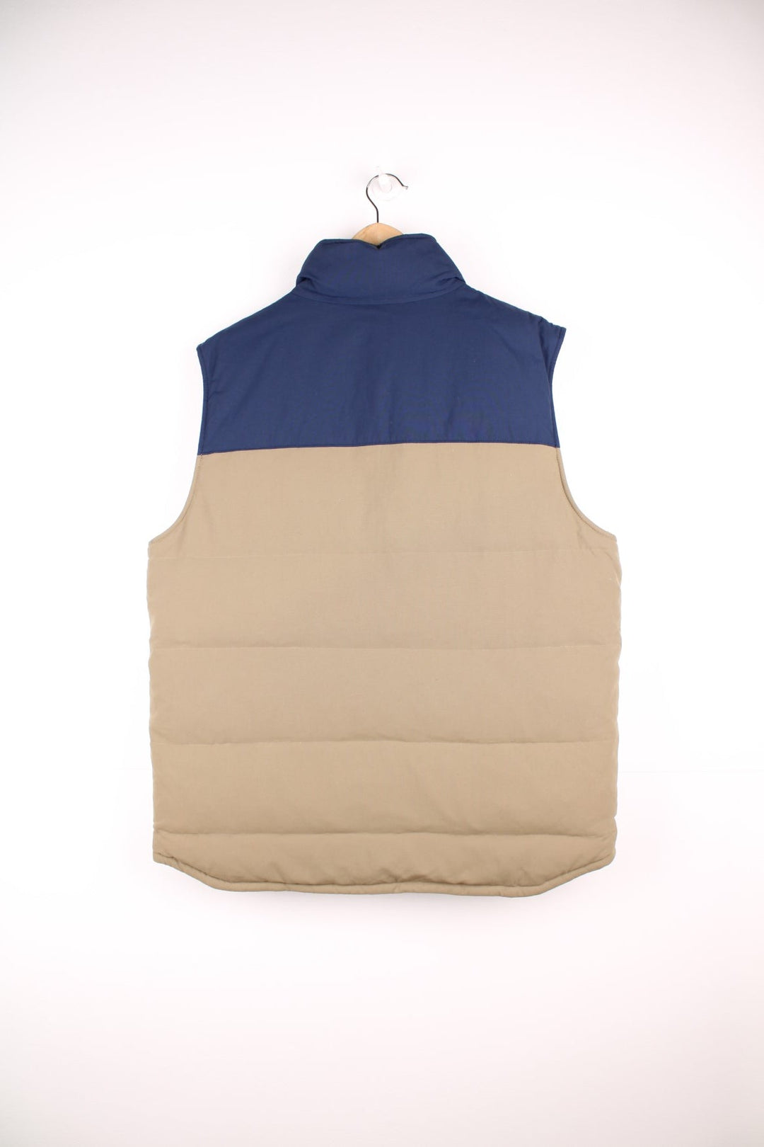Patagonia reversible zip through puffer gilet in navy blue and brown. Features embroidered logo on the chest.