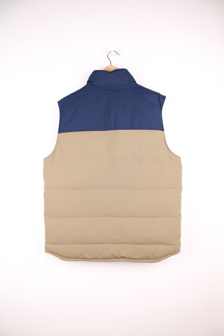 Patagonia reversible zip through puffer gilet in navy blue and brown. Features embroidered logo on the chest.