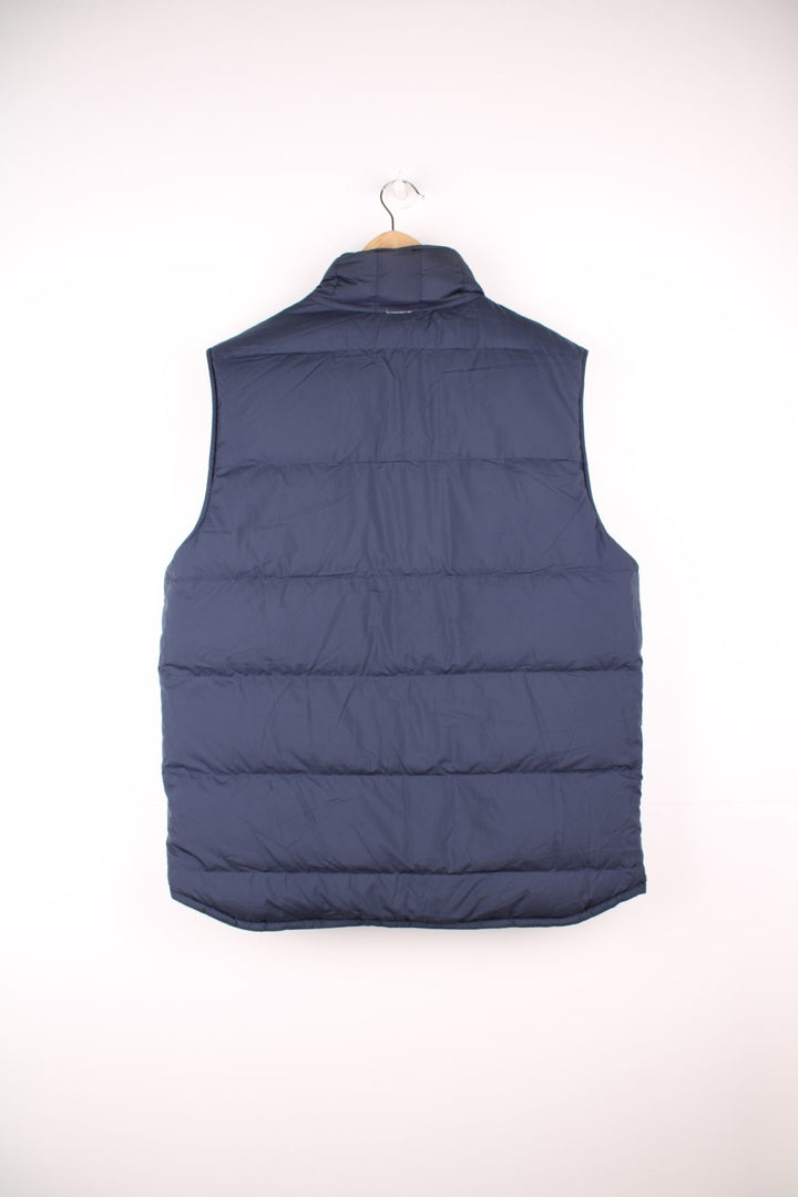 Patagonia reversible zip through puffer gilet in navy blue and brown. Features embroidered logo on the chest.