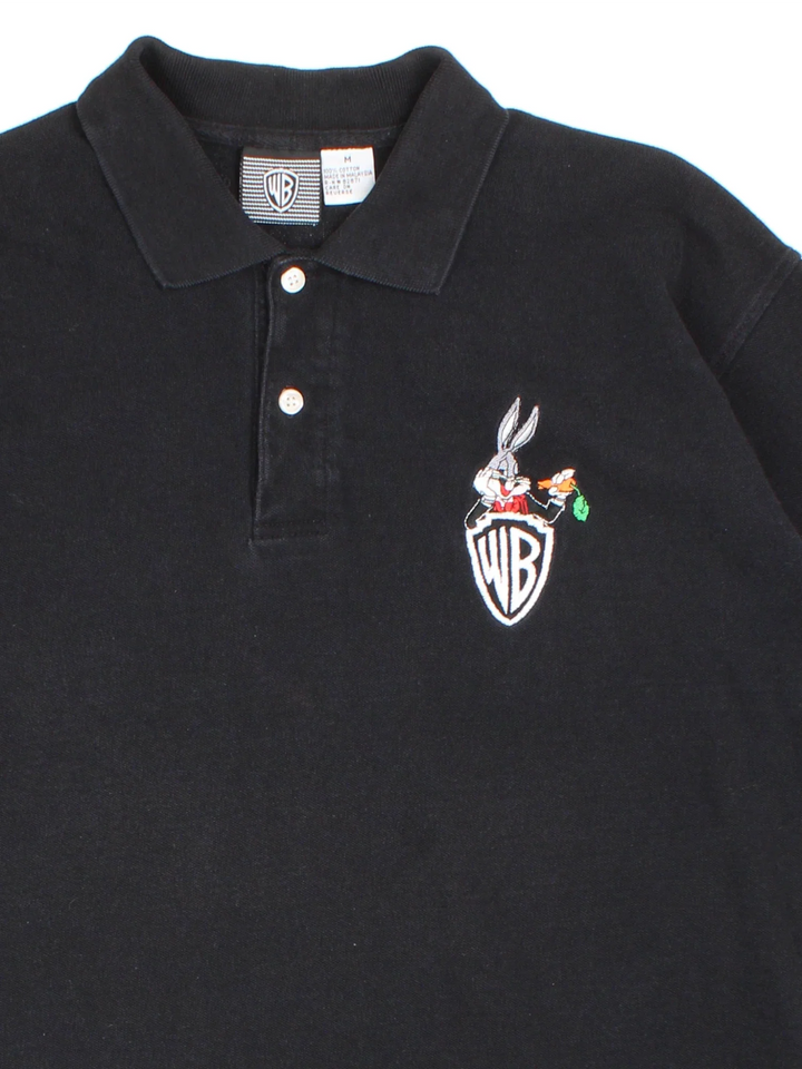 Vintage 90's Warner Bros Bugs Bunny Looney Tunes Polo Shirt in a black colourway, button up collar with the logo and Bugs Bunny graphic embroidered on the front.