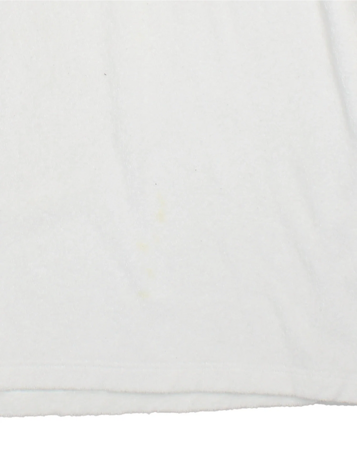 Vintage 90's Miller Lite Hockey Polo Shirt in a white colourway, towelling material, zip up collar with the logo and hockey graphic embroidered on the front.