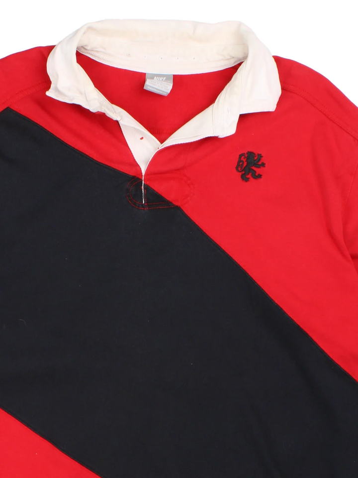 Nike LeBron James Vivat Rex Polo Rugby Shirt in a red and navy colourway, button up collar with the logo embroidered on the front and number 6 and the spell out on the back.