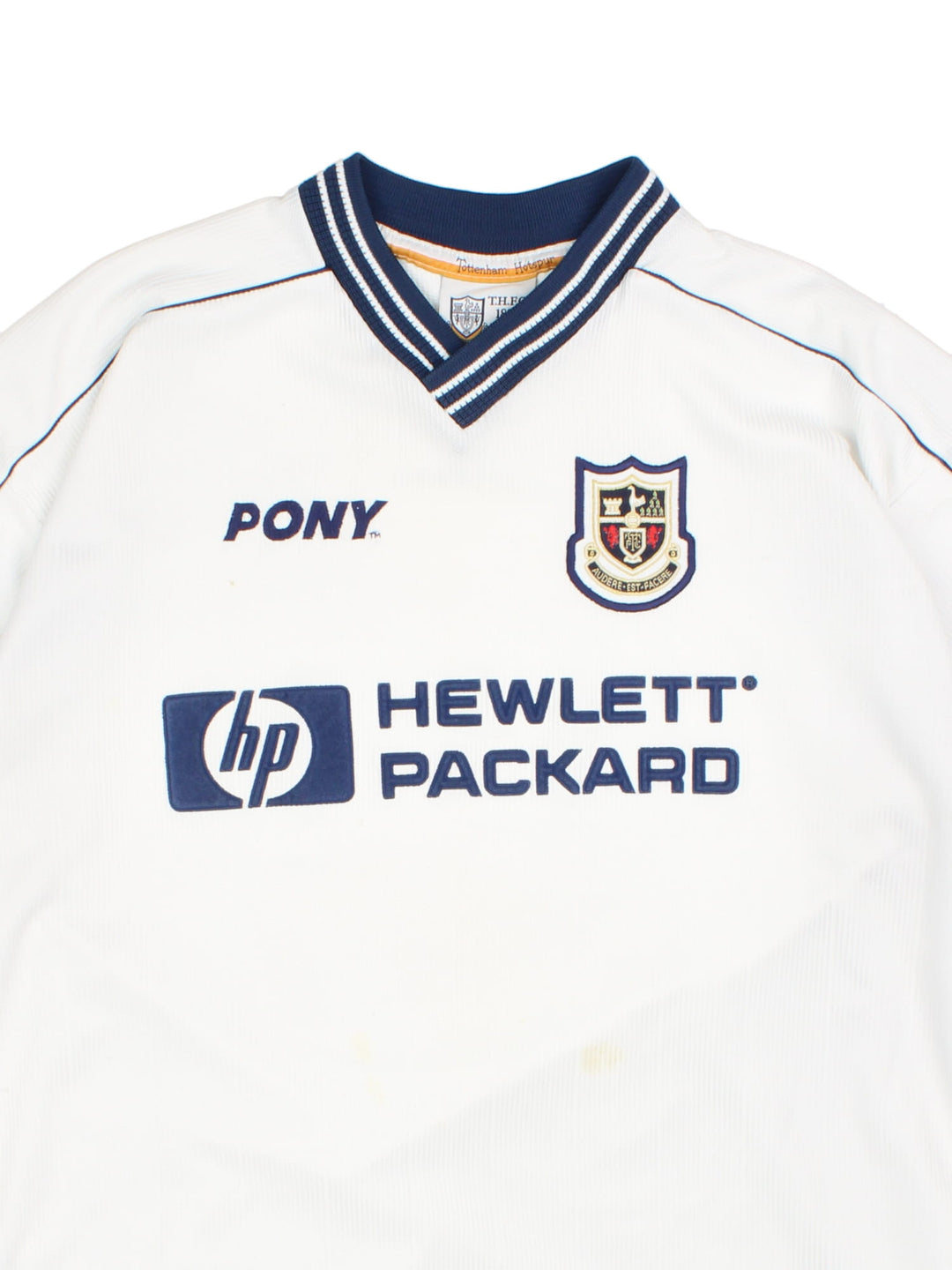 Tottenham 1997/99 Pony home kit football shirt in black with navy blue detailing at the collar and cuffs, logos embroidered on the front and the team motto on the back.