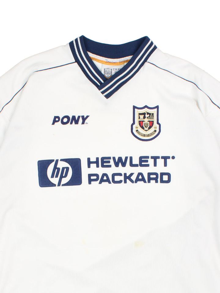 Tottenham 1997/99 Pony home kit football shirt in black with navy blue detailing at the collar and cuffs, logos embroidered on the front and the team motto on the back.