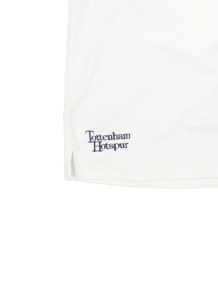 Tottenham 1997/99 Pony home kit football shirt in black with navy blue detailing at the collar and cuffs, logos embroidered on the front and the team motto on the back.