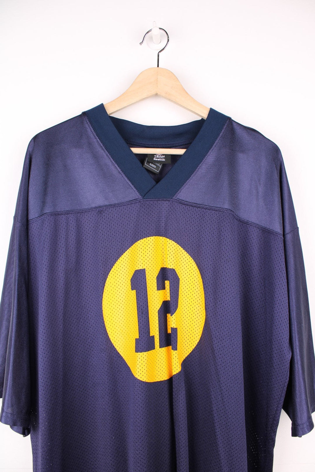 NFL Green Bay Packers Jersey in a blue and yellow colourway, Aaron Rodgers number 12 printed on the front and back, and has the logo on the sleeves.