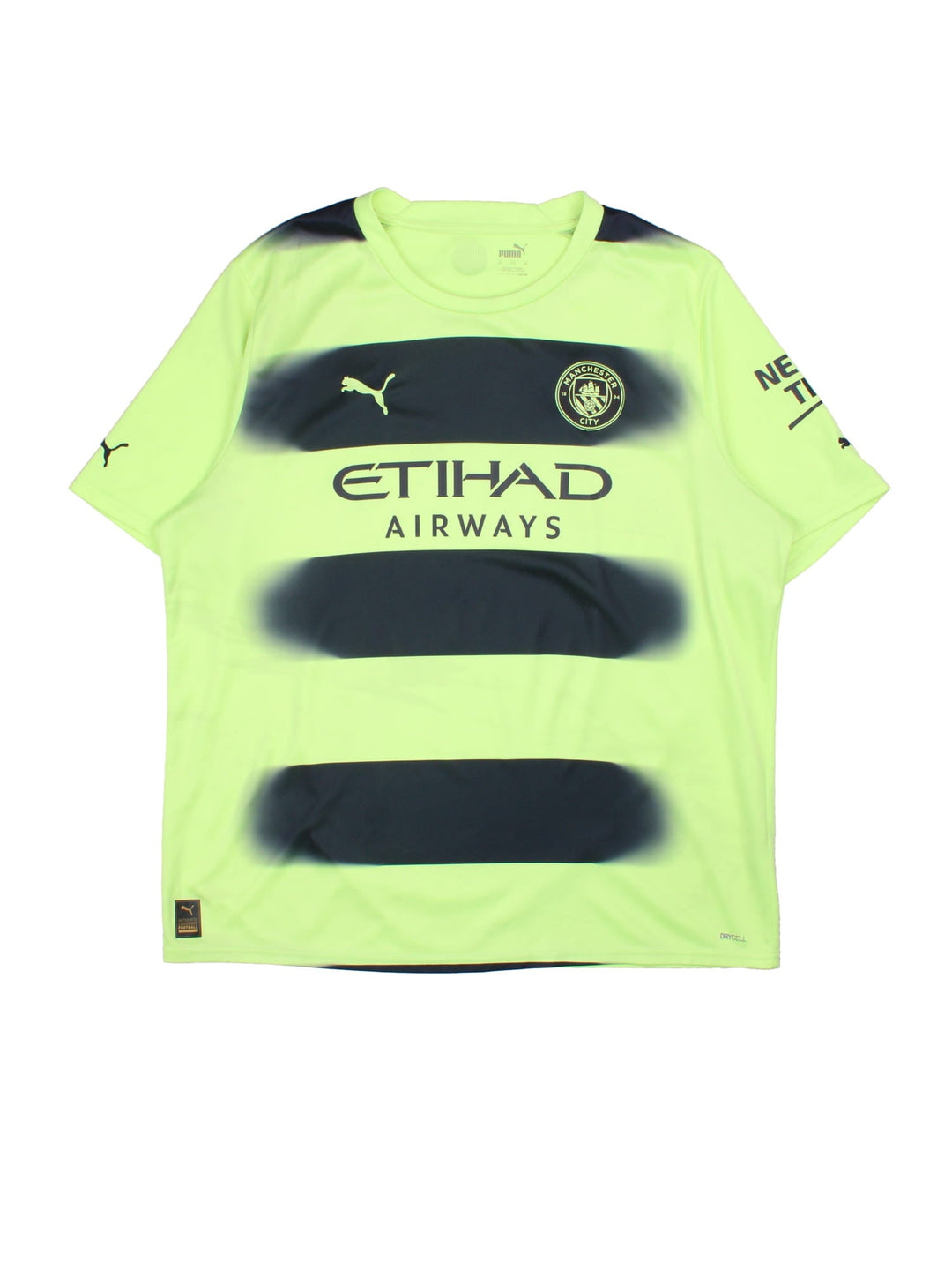 Manchester City 2022/23 Puma Football Shirt in the neon green green and black third kit colourway, features embroidered logos and badge on the front.
