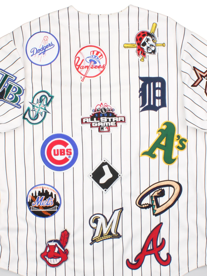 2003 All Star MLB Majestic Baseball Jersey in a white colourway, features embroidered team logo's and patches all over and classic sleeve and stripe detailing.