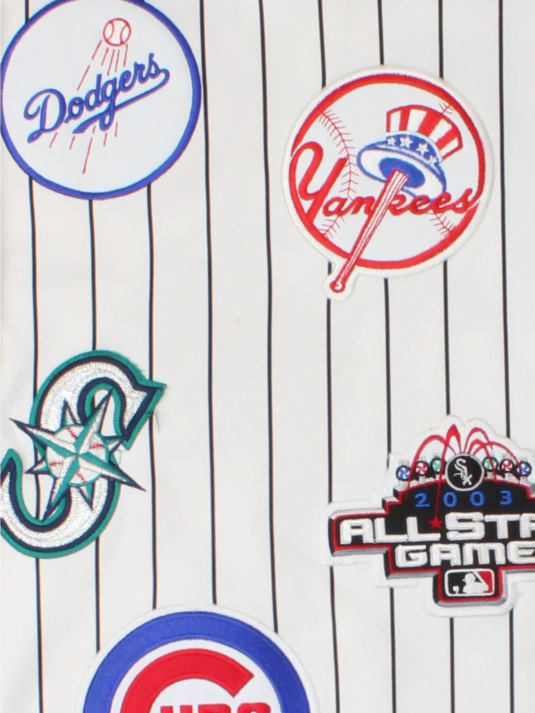 2003 All Star MLB Majestic Baseball Jersey in a white colourway, features embroidered team logo's and patches all over and classic sleeve and stripe detailing.
