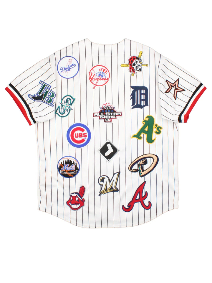 2003 All Star MLB Majestic Baseball Jersey in a white colourway, features embroidered team logo's and patches all over and classic sleeve and stripe detailing.