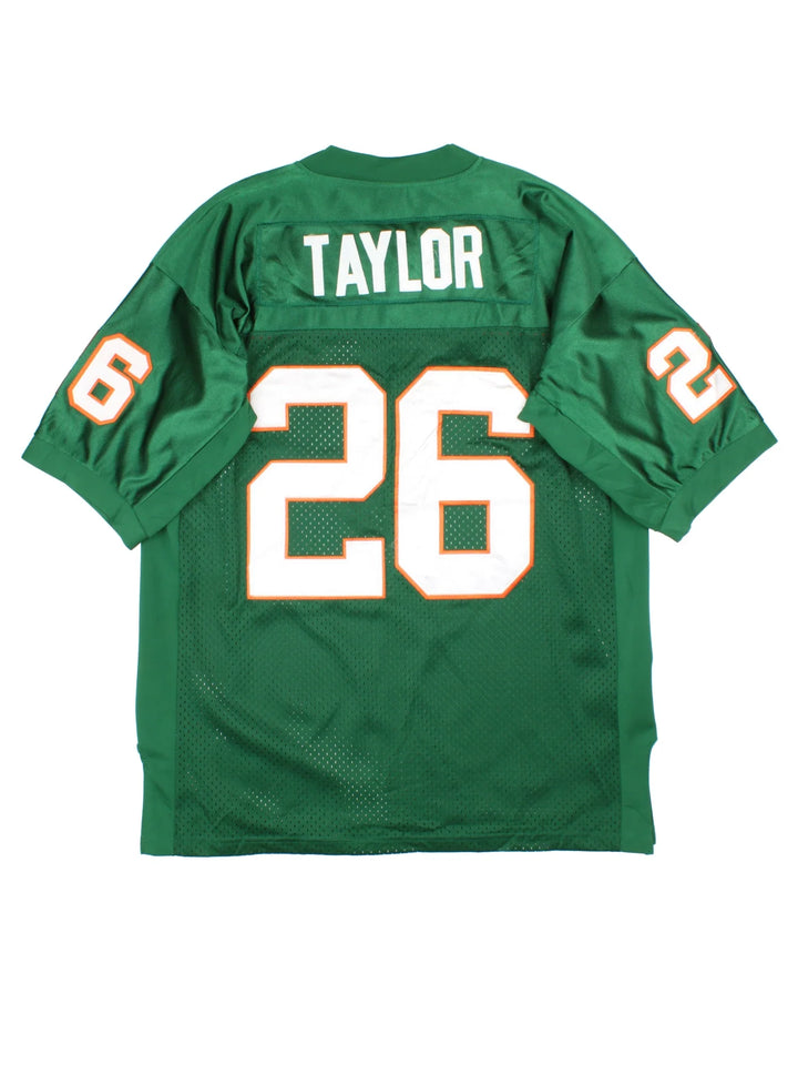 Miami Hurricanes Nike NCAA Football Jersey in a green colourway, features embroidered logos and badge on the front and player name TAYLOR #26 on the back.
