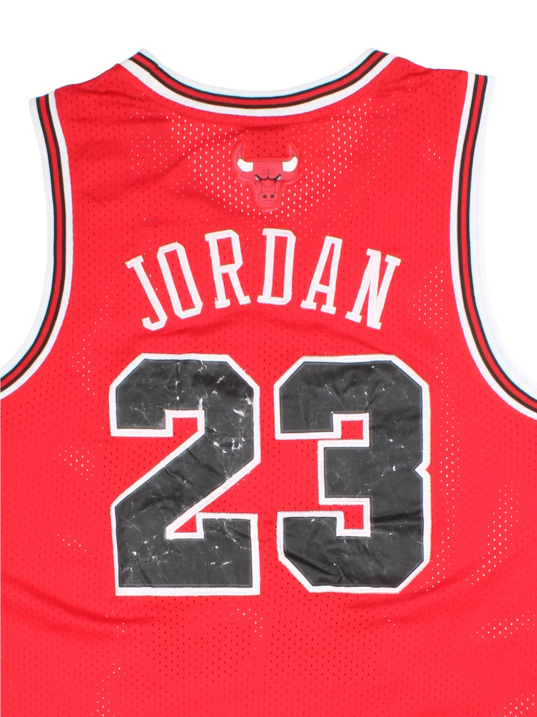 Nike NBA Chicago Bulls Michael Jordan 23 Jersey in the red kit colourway, features embroidered logos and badge on the front and Jordan 23 on the back.