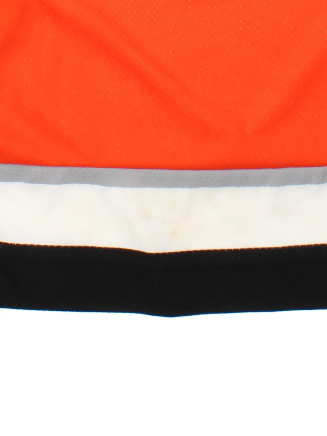 Philadelphia Flyers NHL Jersey in a  orange colourway, features embroidered logos and badge on the front with black and white stripe detailing on the sleeves and hem.
