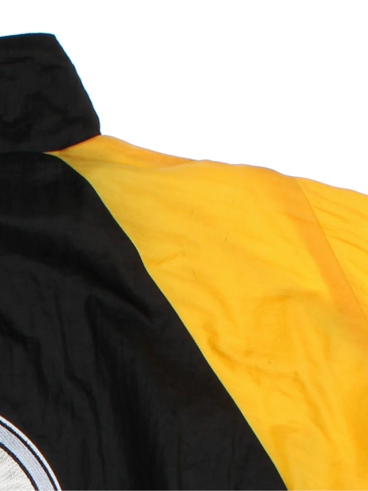 Pittsburgh Steelers NFL Shell Jacket in a black colourway with yellow and white panelling. Full zip up and pockets, with small classic logo on the front and large logo on the back.