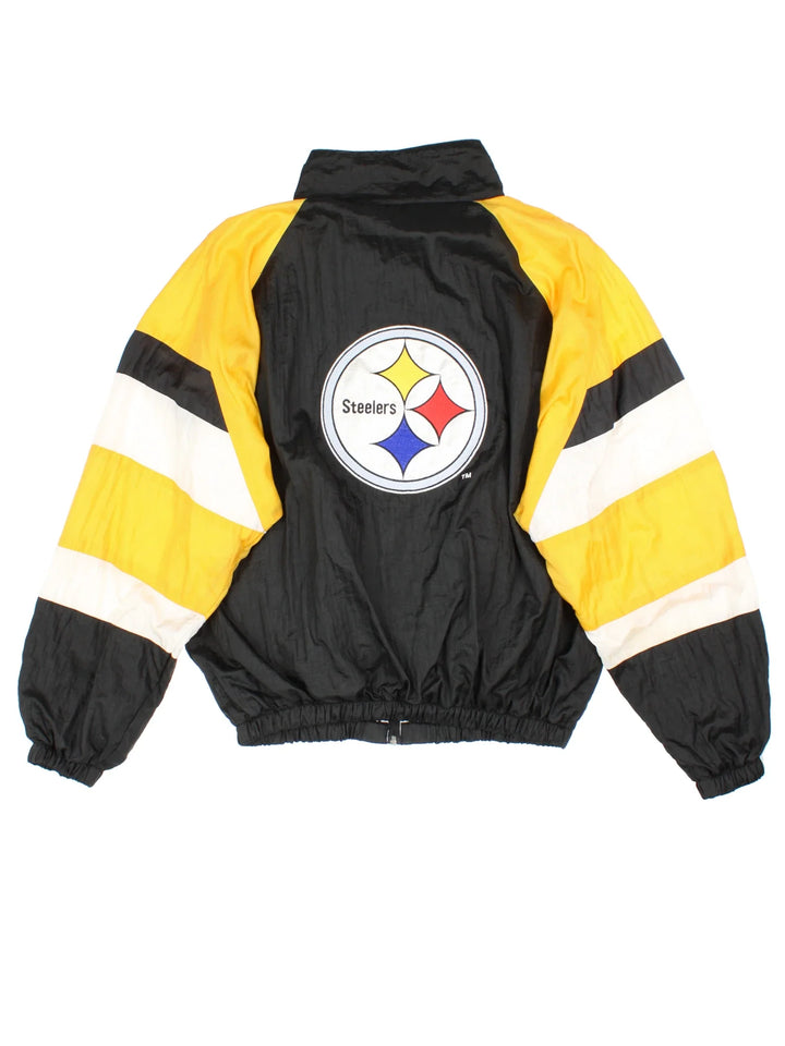 Pittsburgh Steelers NFL Shell Jacket in a black colourway with yellow and white panelling. Full zip up and pockets, with small classic logo on the front and large logo on the back.