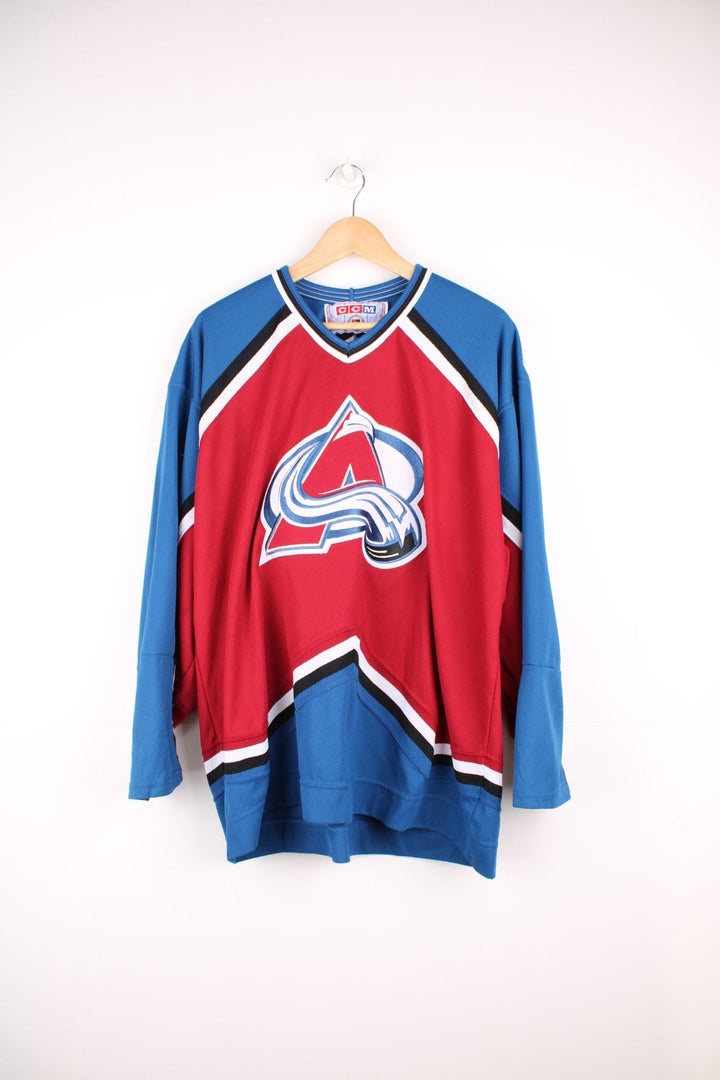 Vintage Colorado Avalanche CCM, NHL Hockey jersey in a red, white and blue colourway. 