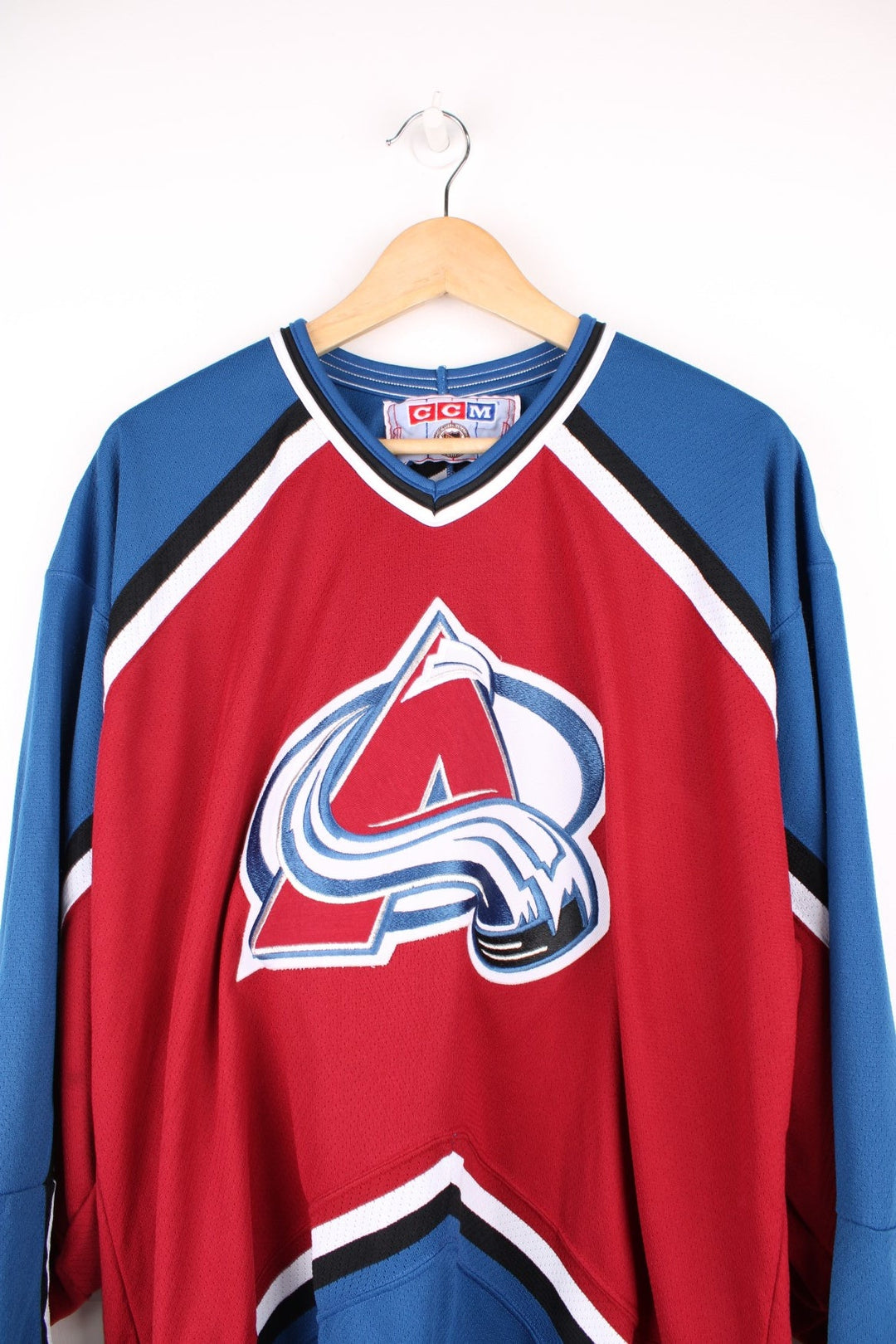 Vintage Colorado Avalanche CCM, NHL Hockey jersey in a red, white and blue colourway. 