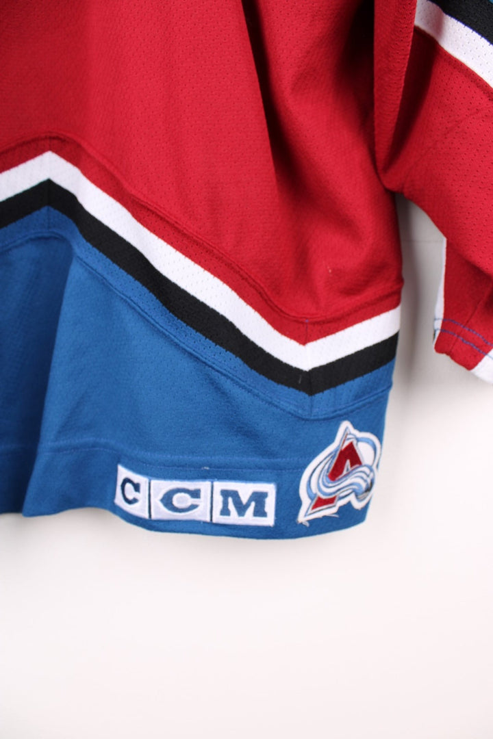 Vintage Colorado Avalanche CCM, NHL Hockey jersey in a red, white and blue colourway. 