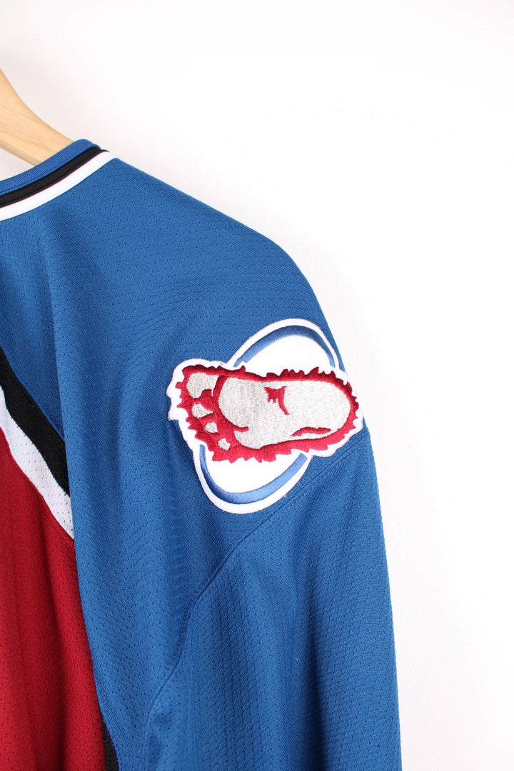 Vintage Colorado Avalanche CCM, NHL Hockey jersey in a red, white and blue colourway. 