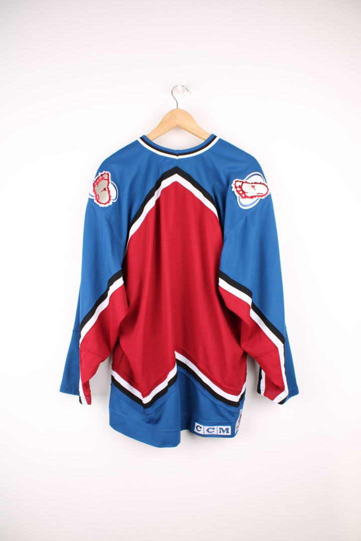 Vintage Colorado Avalanche CCM, NHL Hockey jersey in a red, white and blue colourway. 
