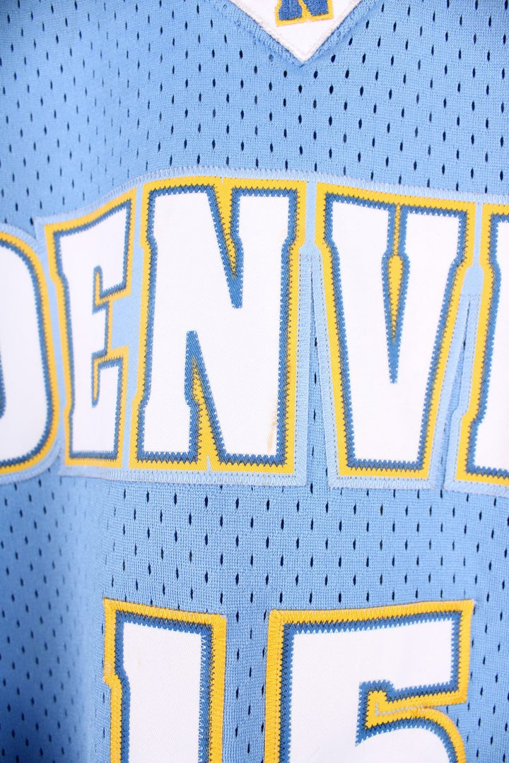 Denver Nuggets NBA in blue with yellow and white accents, multiple embroidered logos and no.15 Anthony on the back.