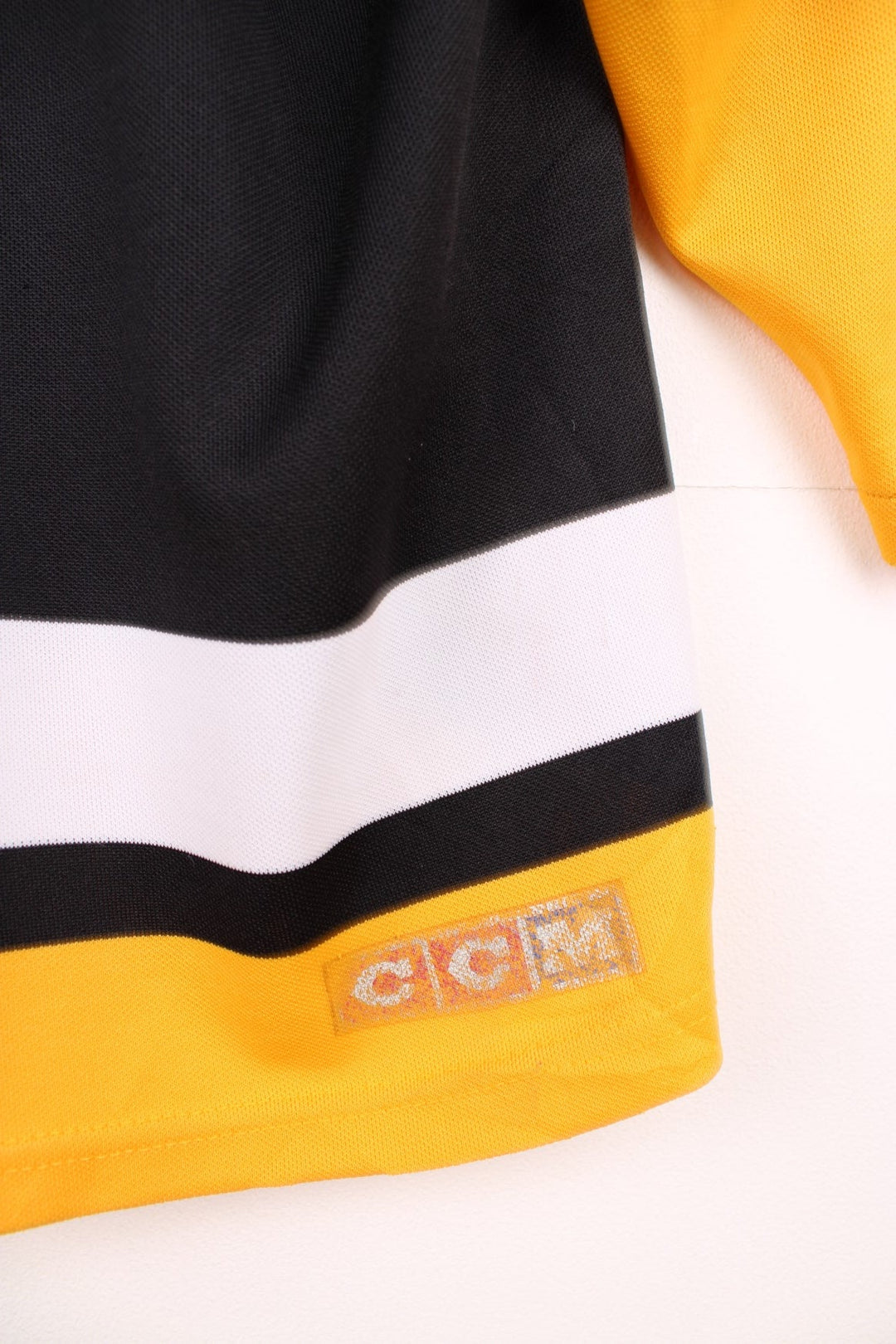 90s Pittsburgh Penguins CCM, NHL hockey jersey in a black, white and yellow colourway.