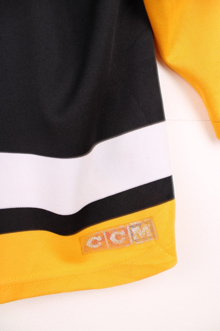 90s Pittsburgh Penguins CCM, NHL hockey jersey in a black, white and yellow colourway.