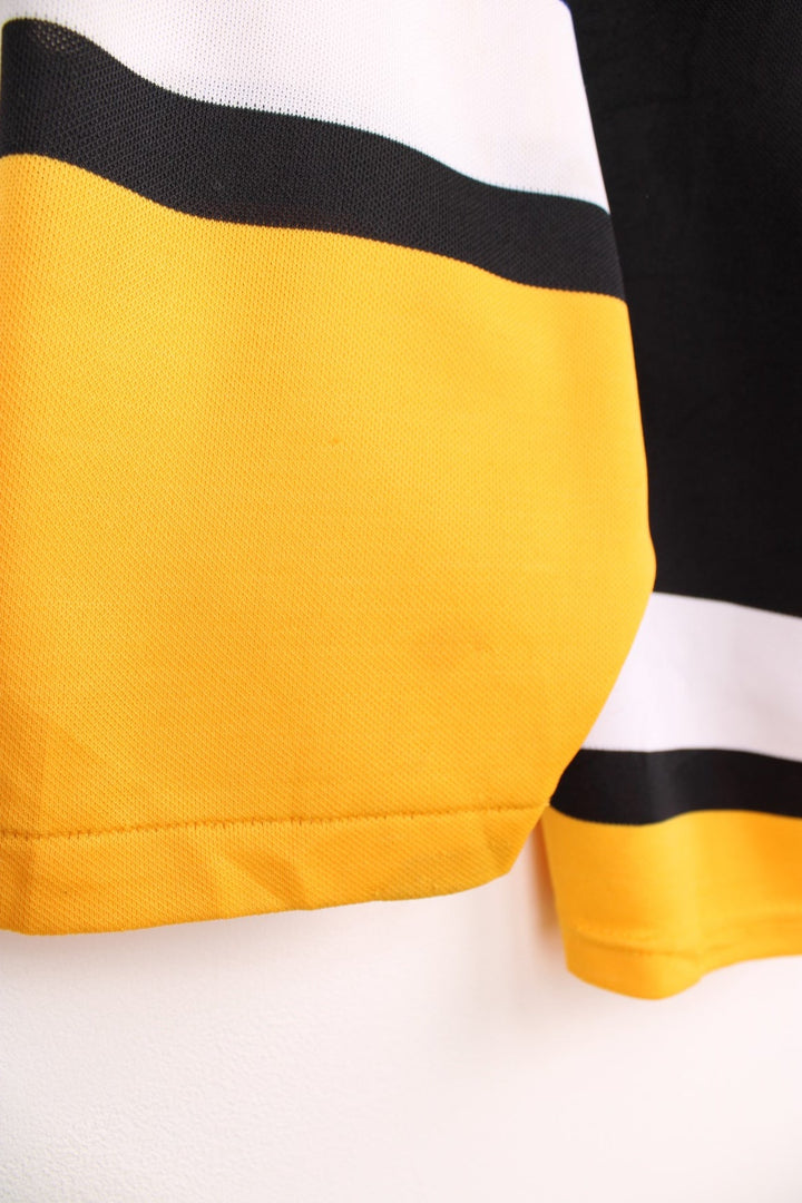 90s Pittsburgh Penguins CCM, NHL hockey jersey in a black, white and yellow colourway.