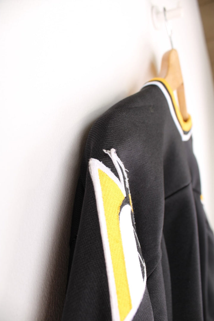 90s Pittsburgh Penguins CCM, NHL hockey jersey in a black, white and yellow colourway.